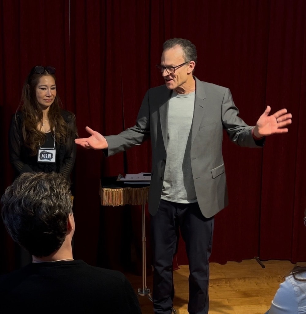 Mark Thomas working with an audience member
